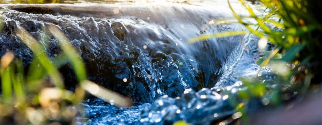 Clean flowing water representing community water access